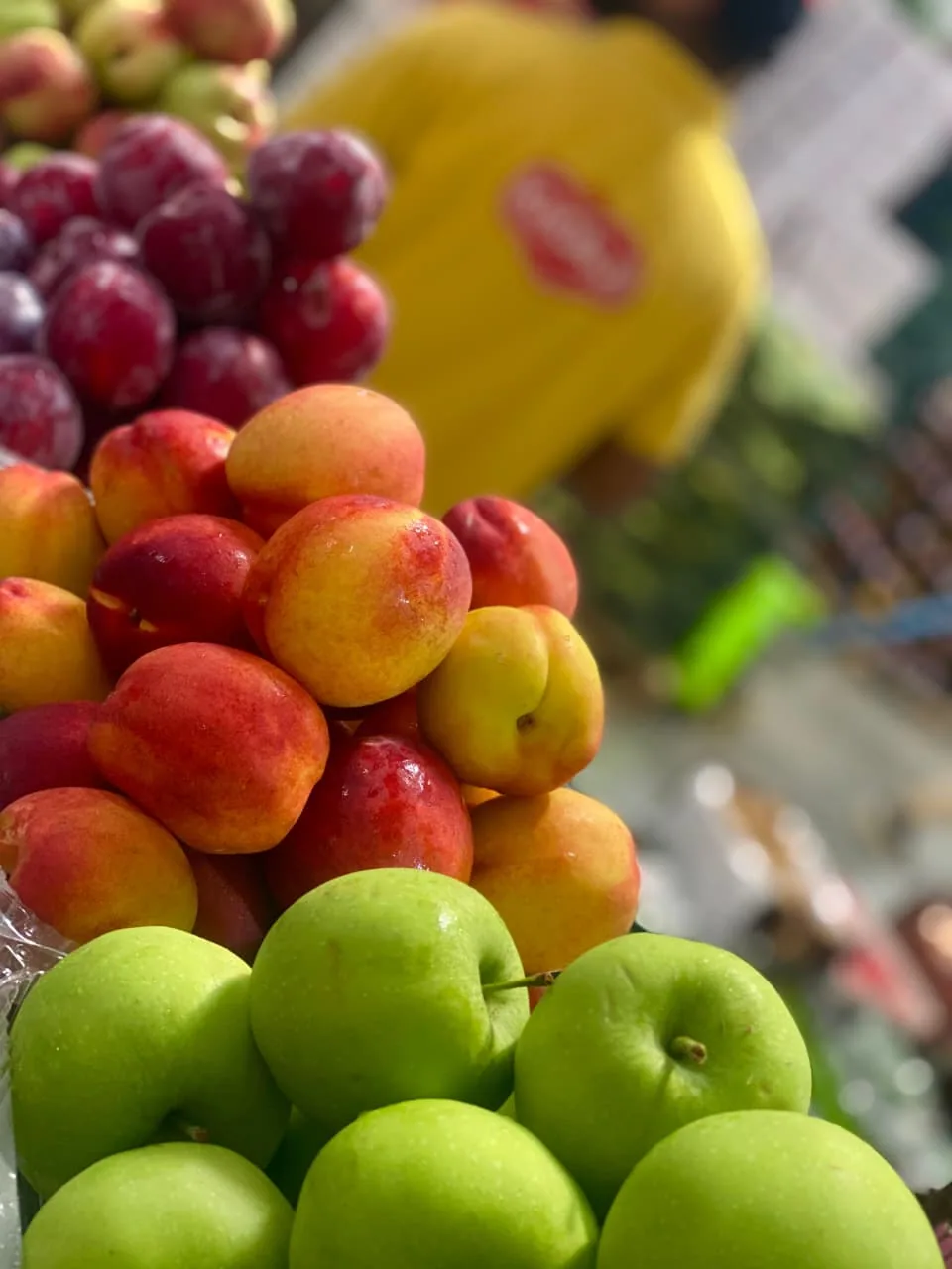 Fresh fruit displayed in a market setting.